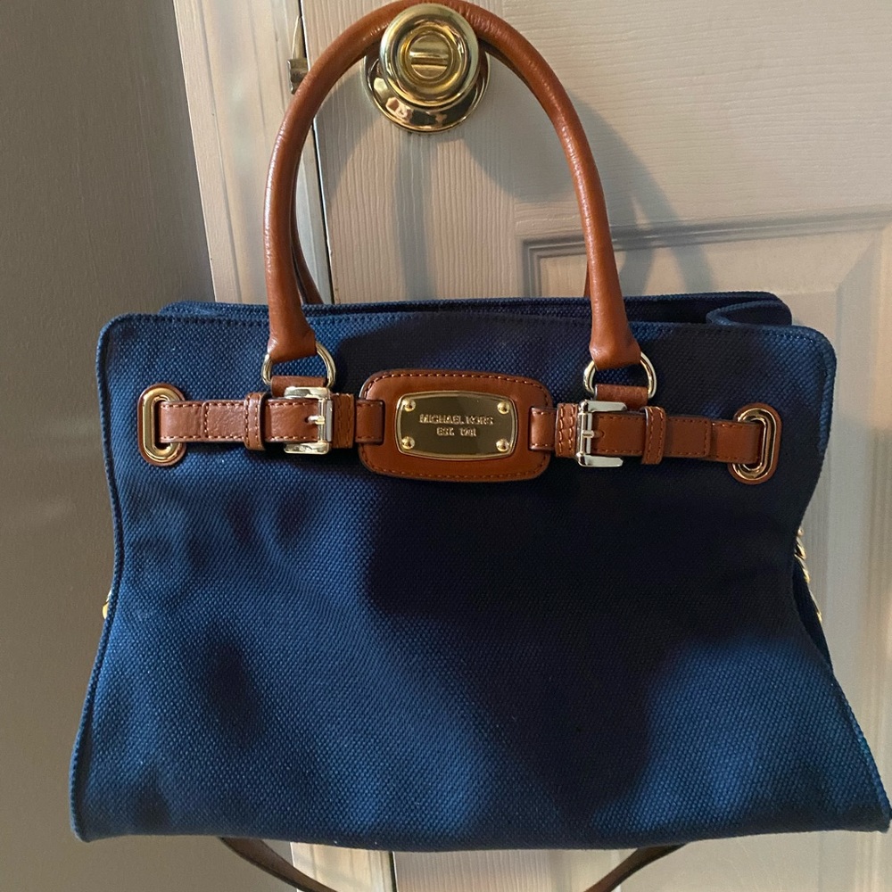 Michael Kors purse. Navy fabric and brown leather. Never been worn.